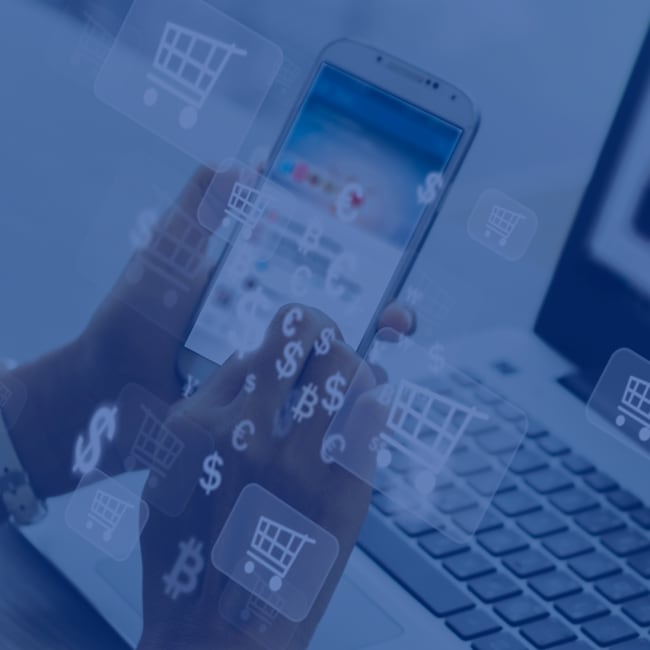 A person online shopping on their phone and laptop. Photo is overlaid with dollar signs and shopping cart icons.